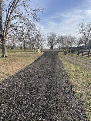 Millings hauled in and graded on existing driveway.