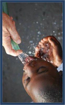 Child enjoying fresh water from purification system