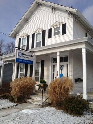 The outside of the duplex building with the entrance to the office