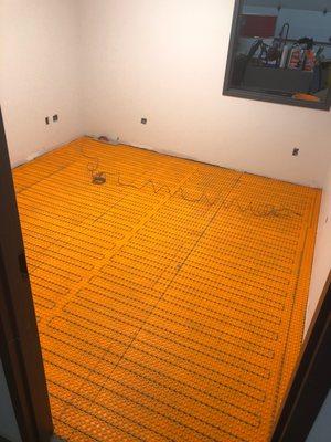 Heated floor Ditra Heat.  Must have a certified Electrician for wire installation.