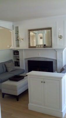 Custom fireplace with bench seating makes this living room much cozier.