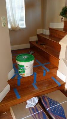 Portion of a beautiful staircase and baseboards. Took some time and love,  but the outcome was beautiful.