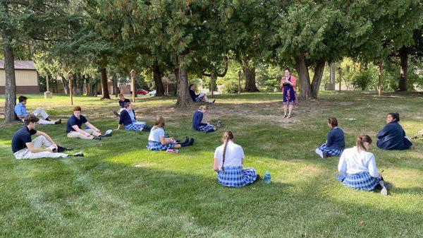 Senior high English class enjoying the outdoors