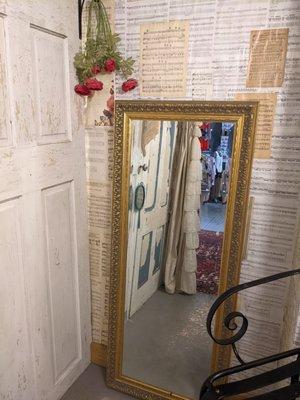 Fitting rooms covered with sheet music.