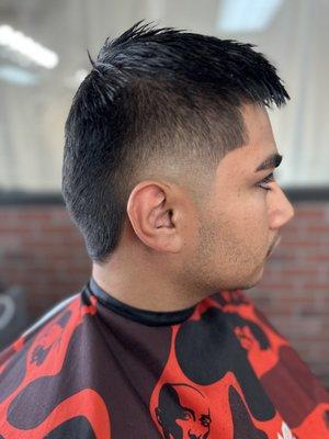 Burst fade with textured top by king James the barber.