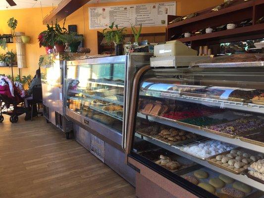 Clean cute bakery. bar stools and tables available to eat in