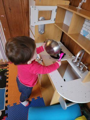 This baby loves her kitchen